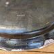 Old oval dish with floral motif called black bottom with staples