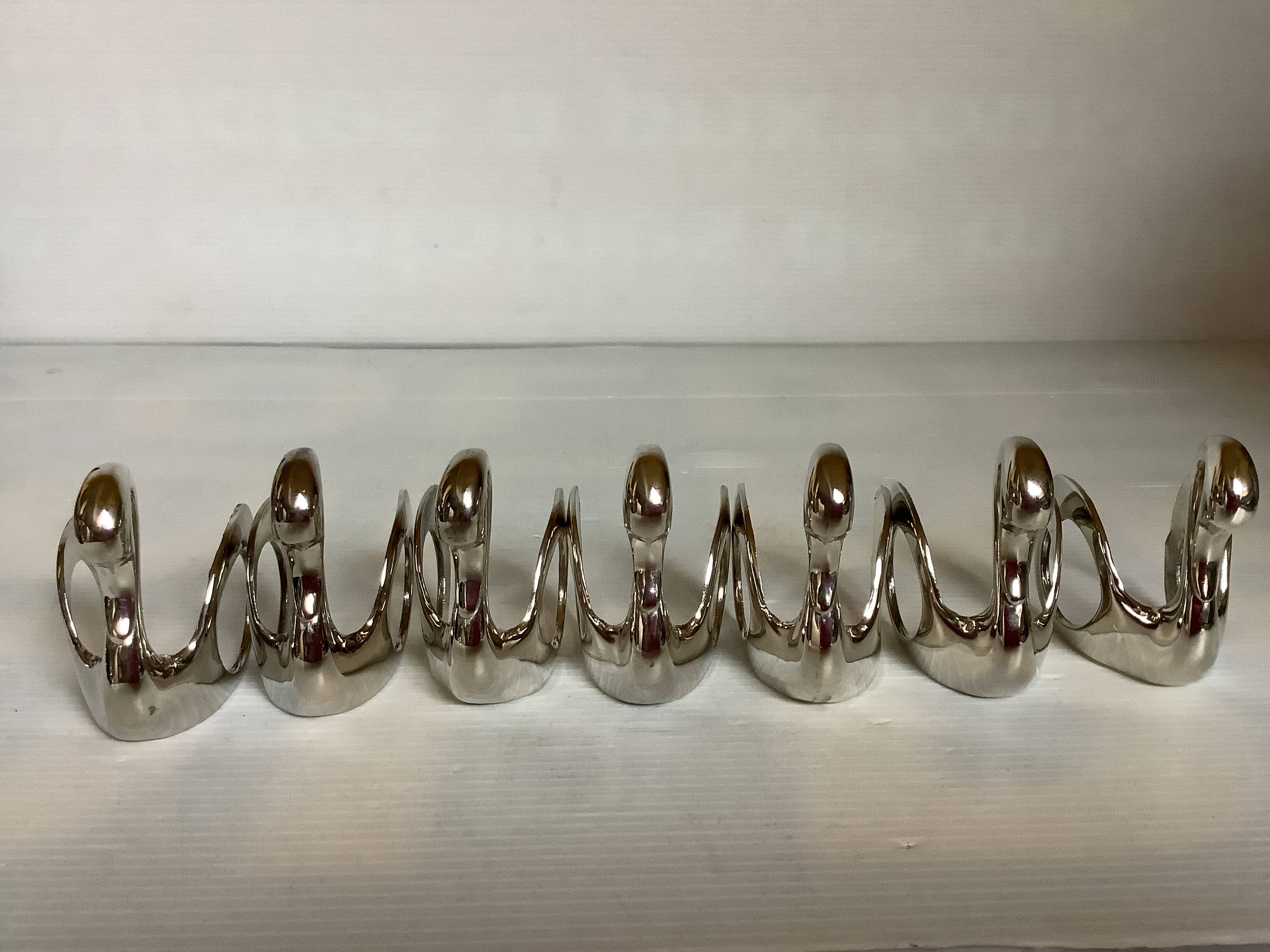 Seven silver-plated zoomorphic metal knife rests