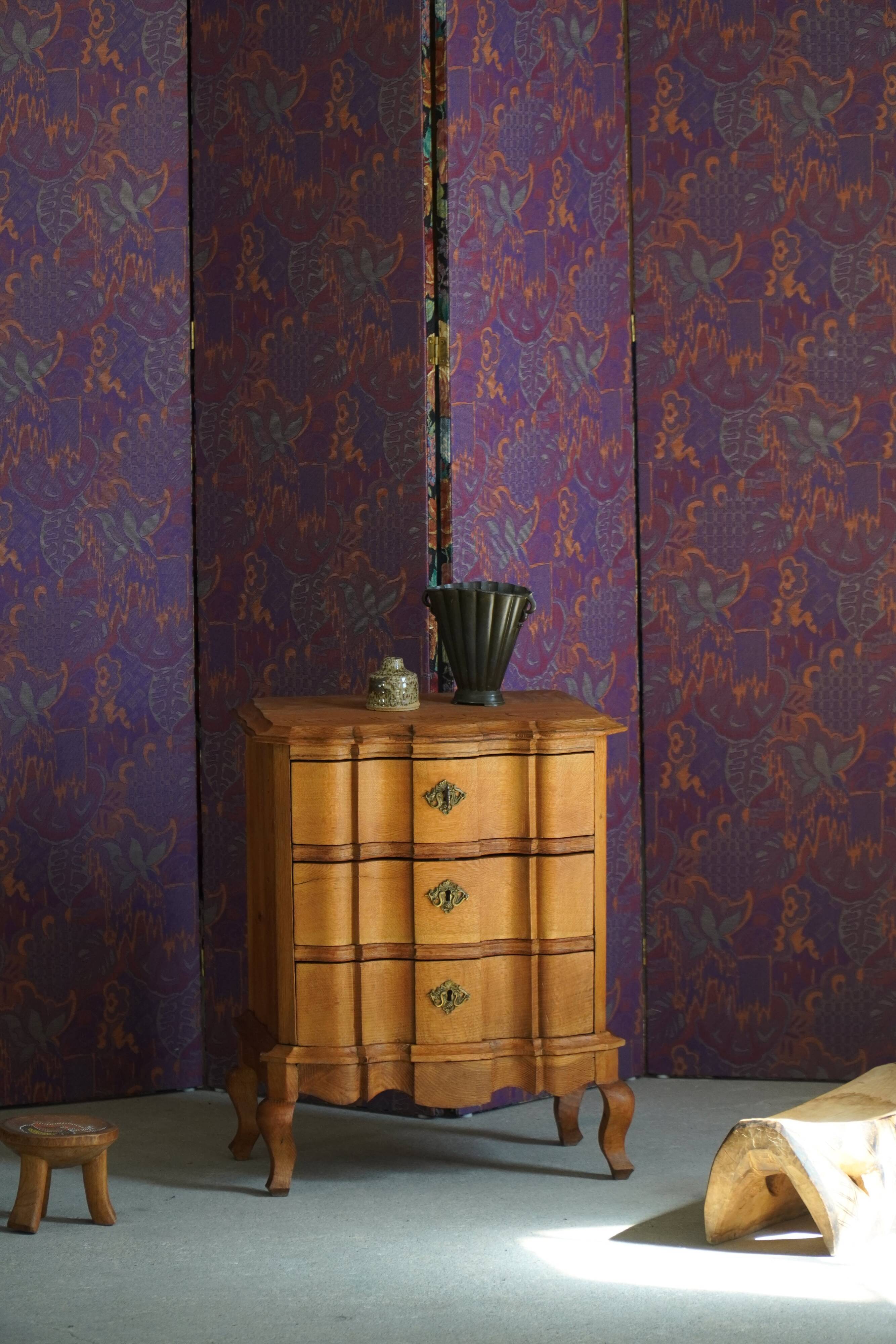 Danish neo-baroque oak commode with three drawers, featuring brass fittings, 1940s.