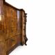 serpentine commode in antique walnut