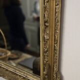 Large antique mirror from the Napoléon III era, finely carved and gilded with gold leaf.