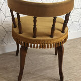 Vintage fringed gondola armchair