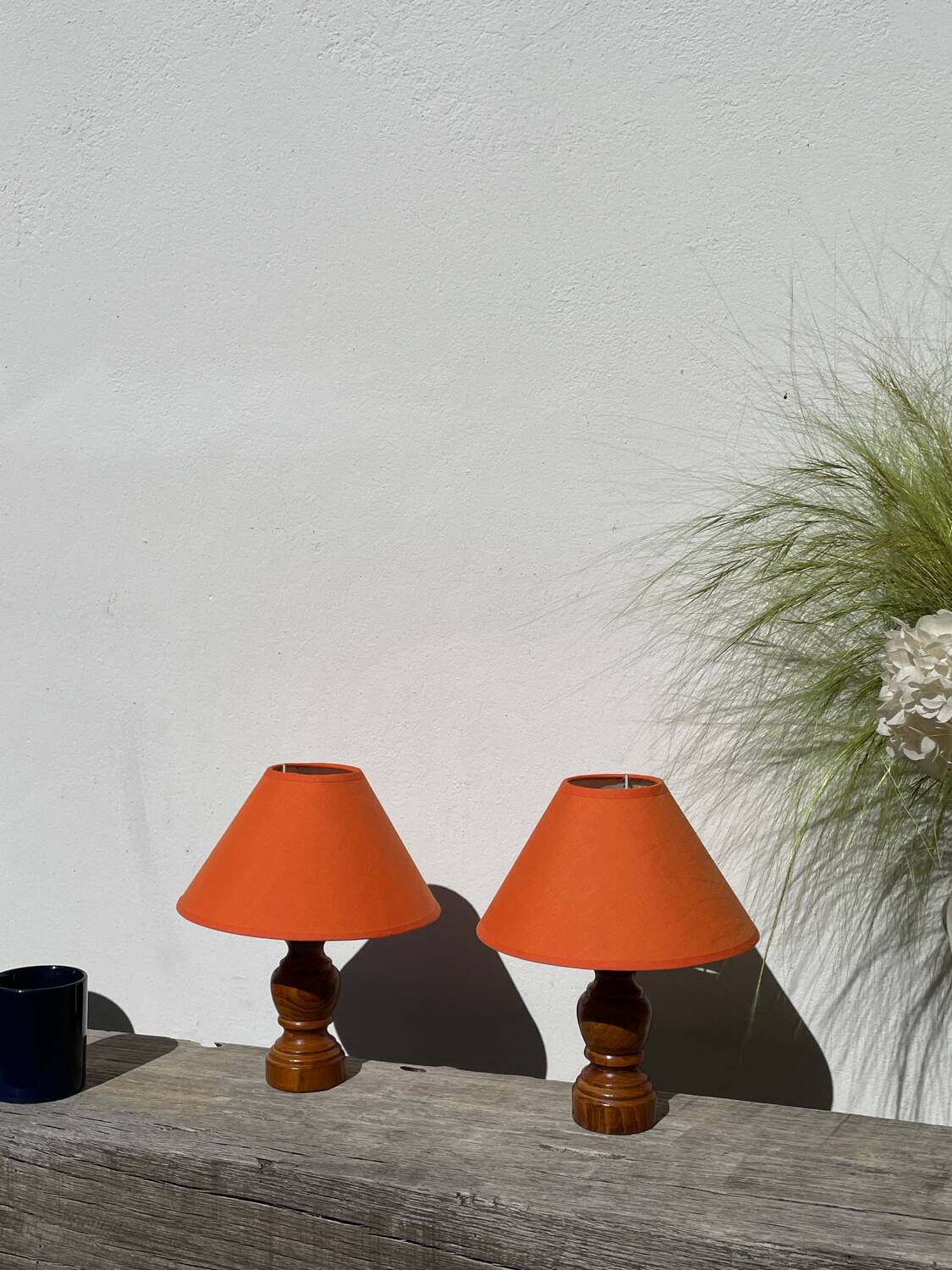 Pair of orange turned wood lamps