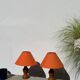 Pair of orange turned wood lamps