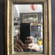 Miniature mirror from the 18th century in gilded wood, mercury glass.