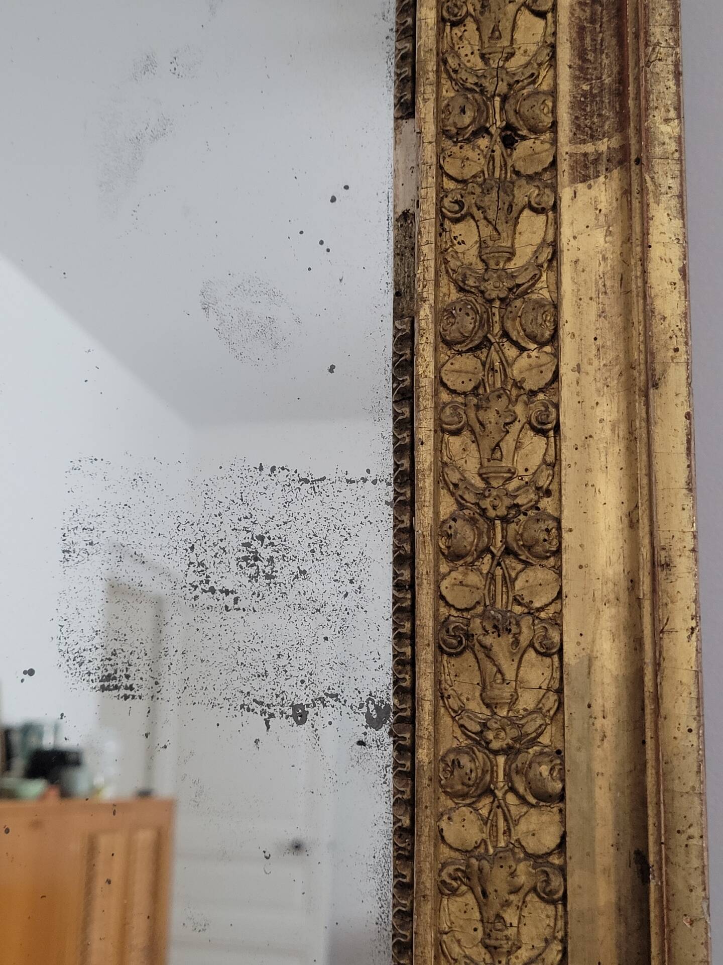 Golden stucco and wood Empire mirror