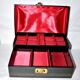 Vintage jewelry box in black leather and red interior