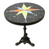 Ceramic compass rose top pedestal table