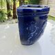 Wall pot in glazed blue terracotta with a grape motif, 1970s.