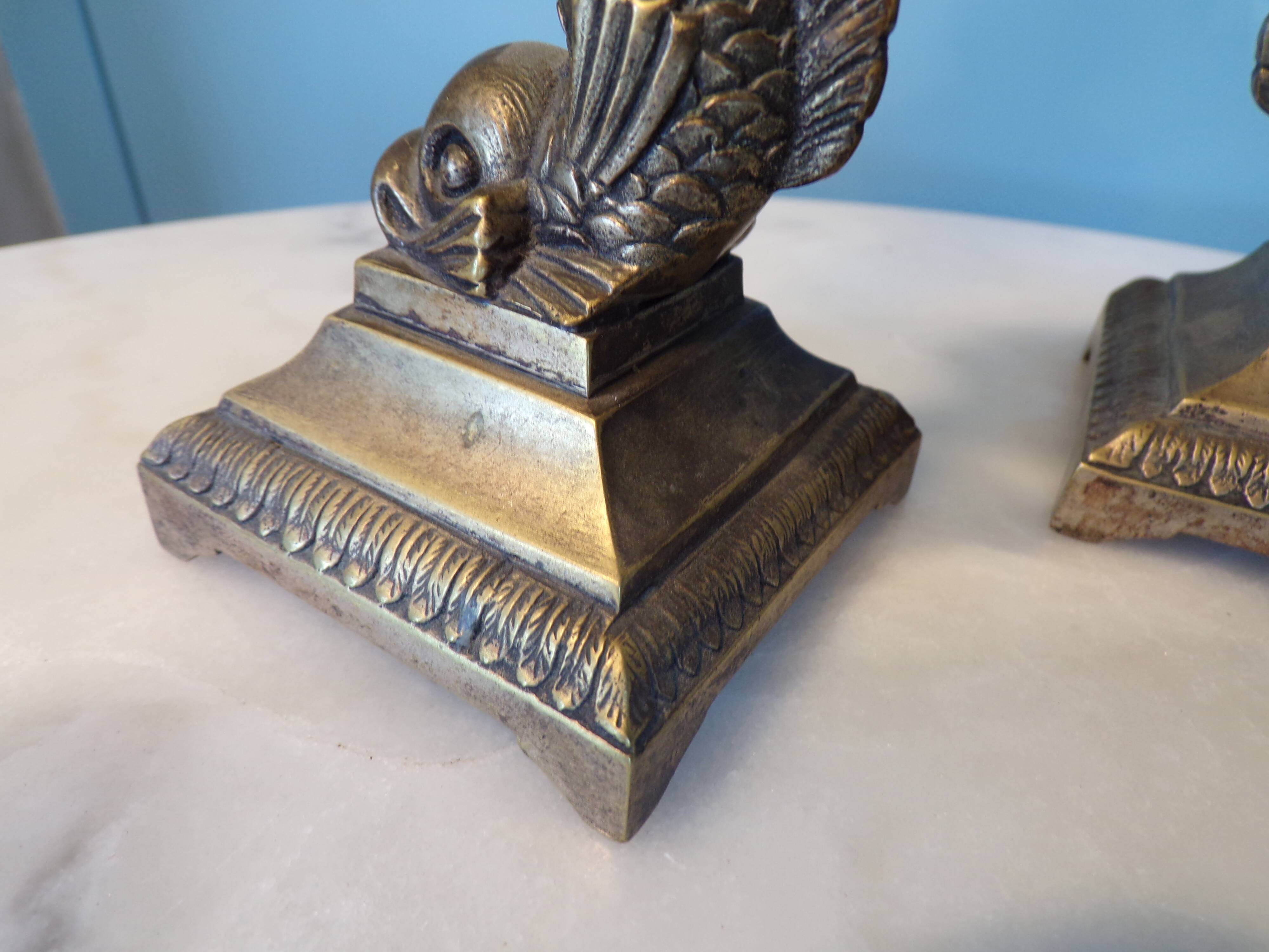 Pair of bronze dolphin candlesticks
