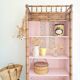 Library, old wooden cabinet imitating bamboo painted in pink