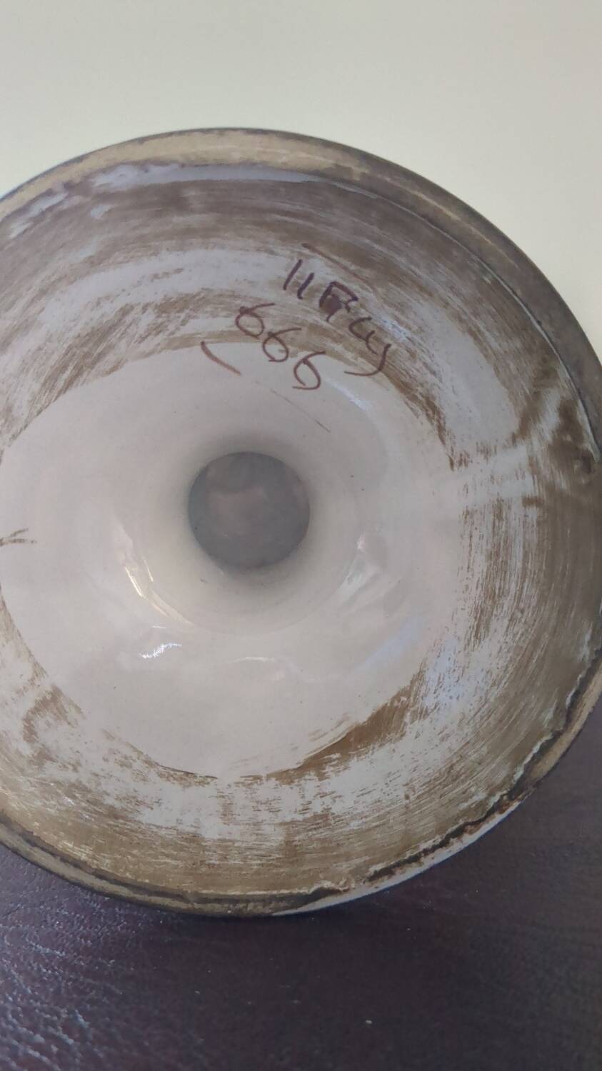 Old porcelain earthenware vase with floral decor