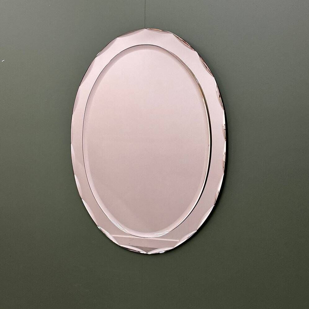 1970s Italian oval mirror by Crystal Arte with faceted glass frame