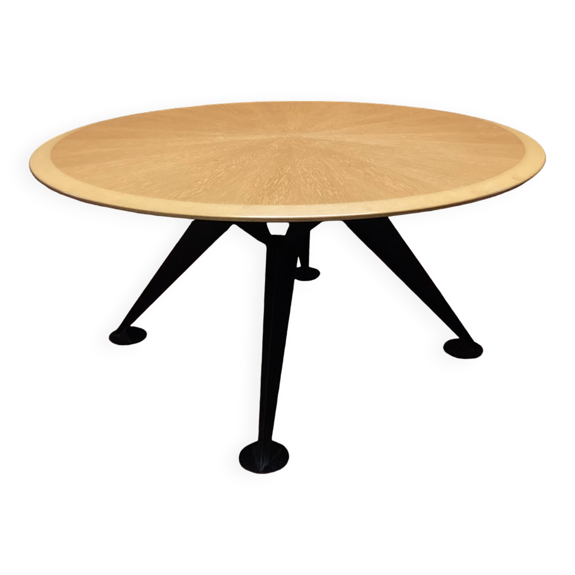 Round wooden and metal quadripod dining table
