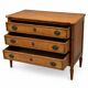 Light walnut commode in Louis XVI style with fluted motifs and three drawers.
