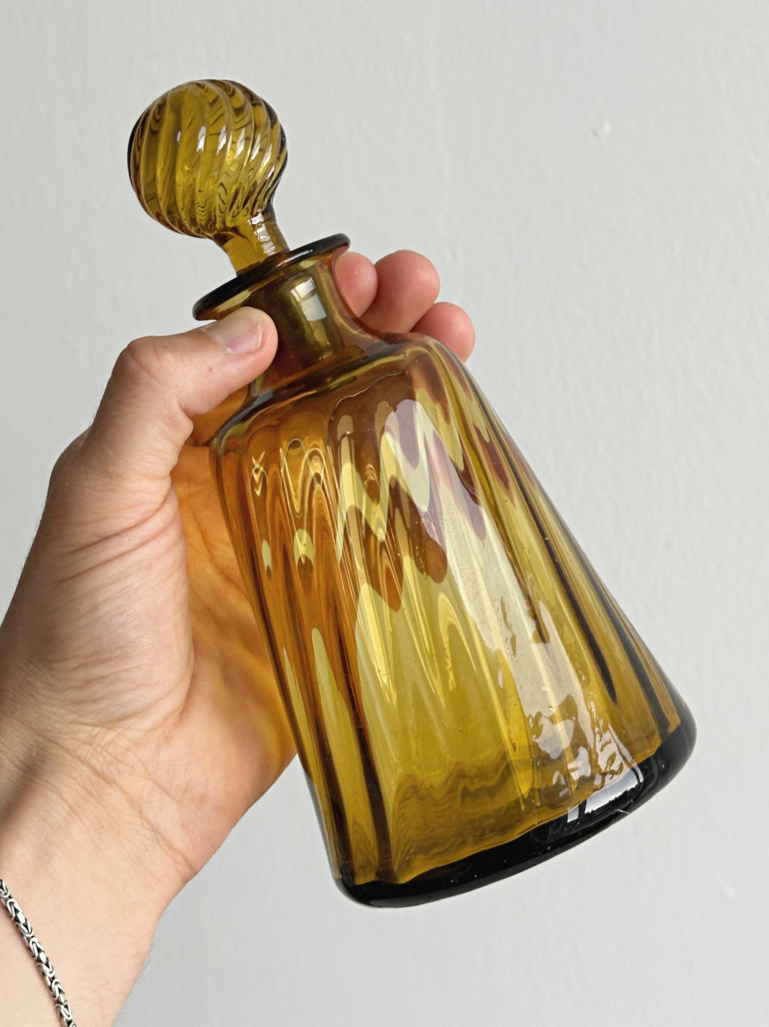 Twisted amber glass carafe