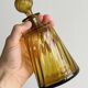 Twisted amber glass carafe