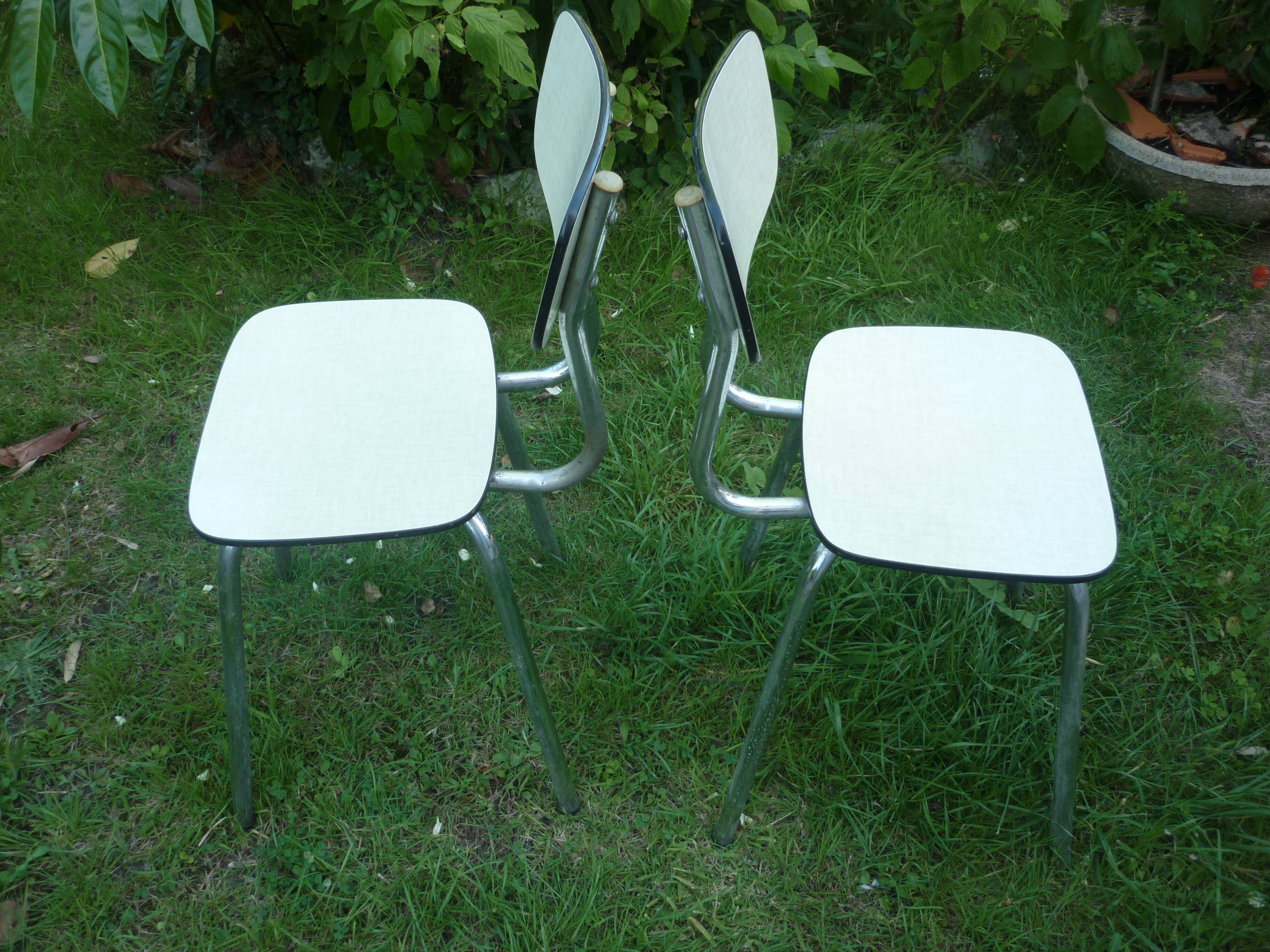 Pair of pale yellow formica chairs