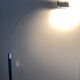 Chromed metal and glass floor lamp designed by Fontana Arte, Falena model by Alvaro Siza, 1990