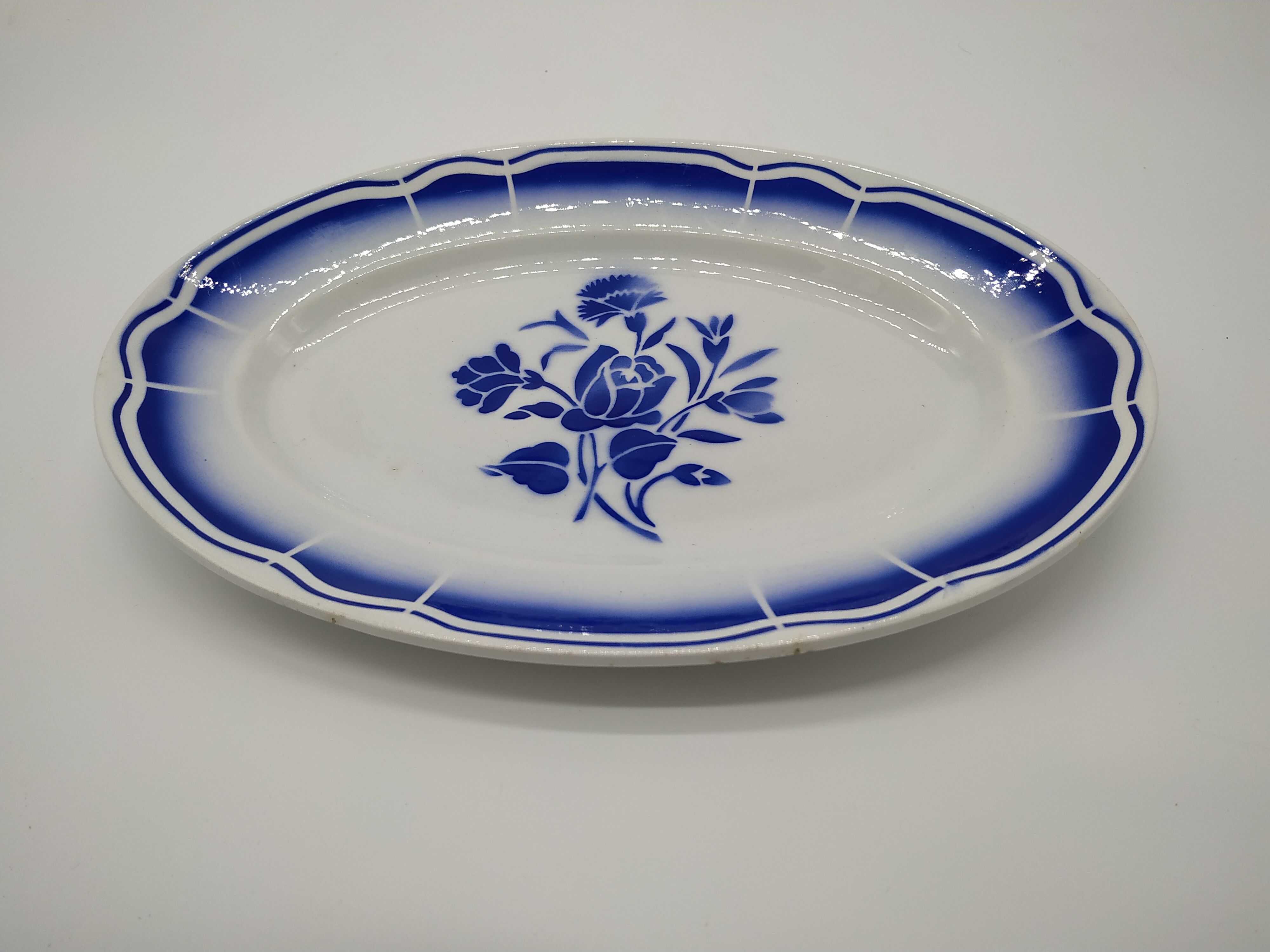 Vintage oval dish decorated with blue bouquet