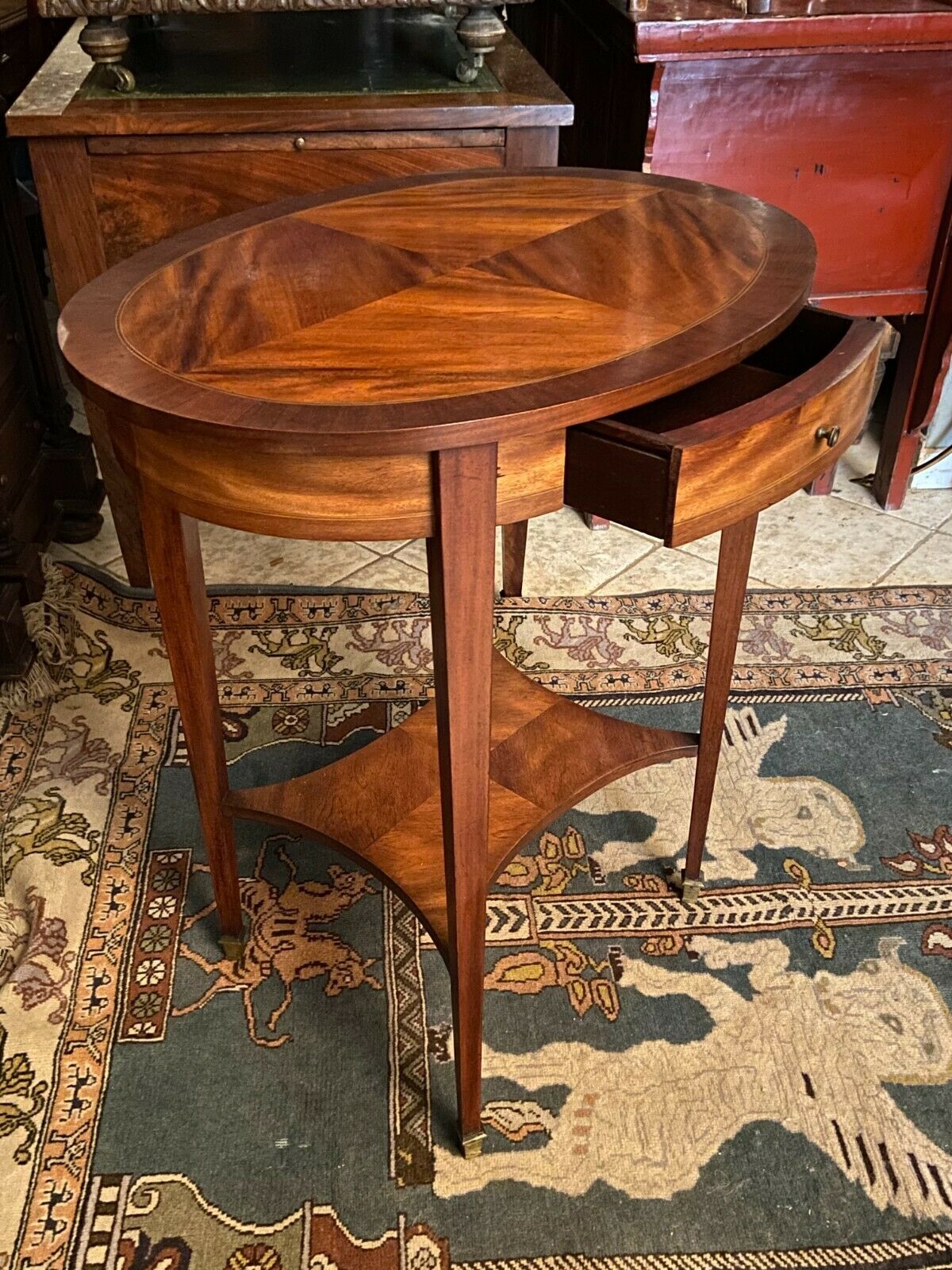 Oval pedestal table with a drawer and a tablet decorated inlaid Louis XVI style