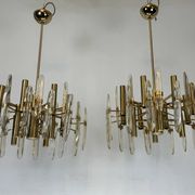 Sciolari, pair of Italian brass and glass chandeliers from 70s
