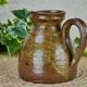 Stoneware pitcher signed Baudat