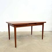 Teak dining table with integrated extensions — Scandinavian