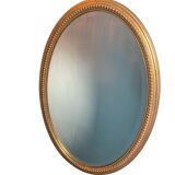 Vintage beveled gold oval mirror
