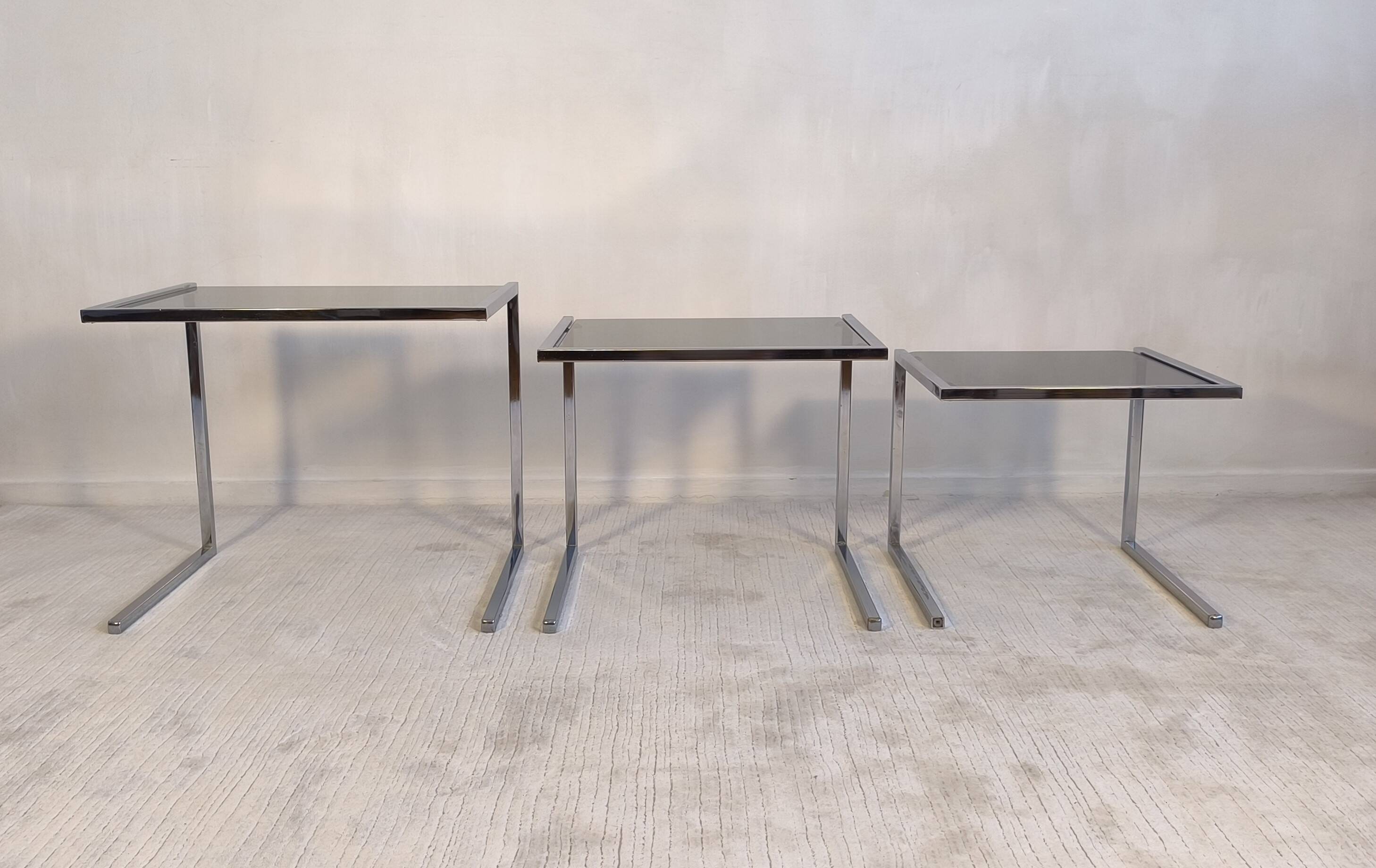 Set of 3 vintage nesting tables in chrome and smoked glass, Roche Bobois style.