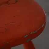 Pair of patinated wooden stools painted red with flared legs, 1950s-1960s.