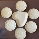 White saucer with raised inlaid pattern