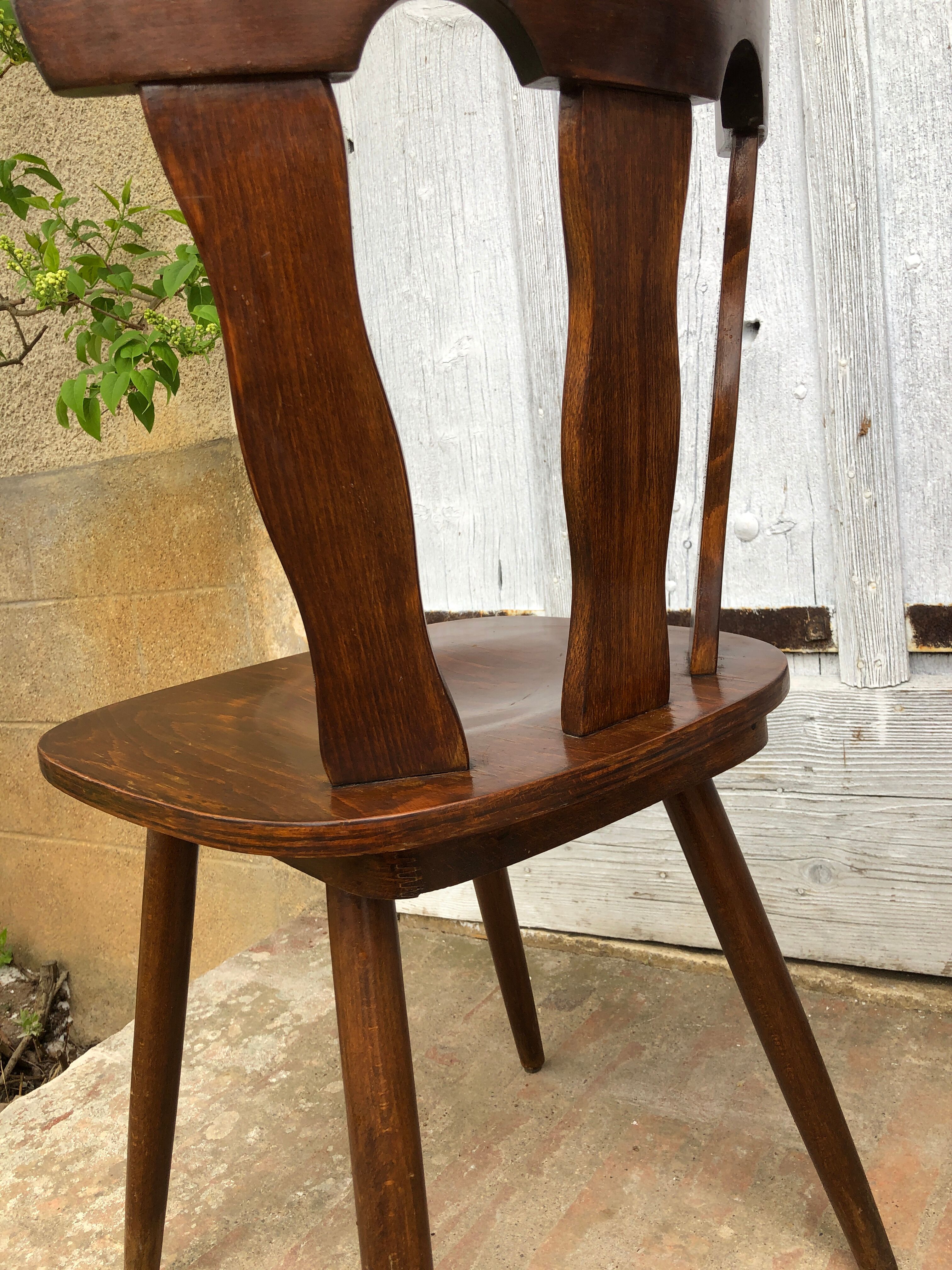 4 brutalist-style wooden chairs