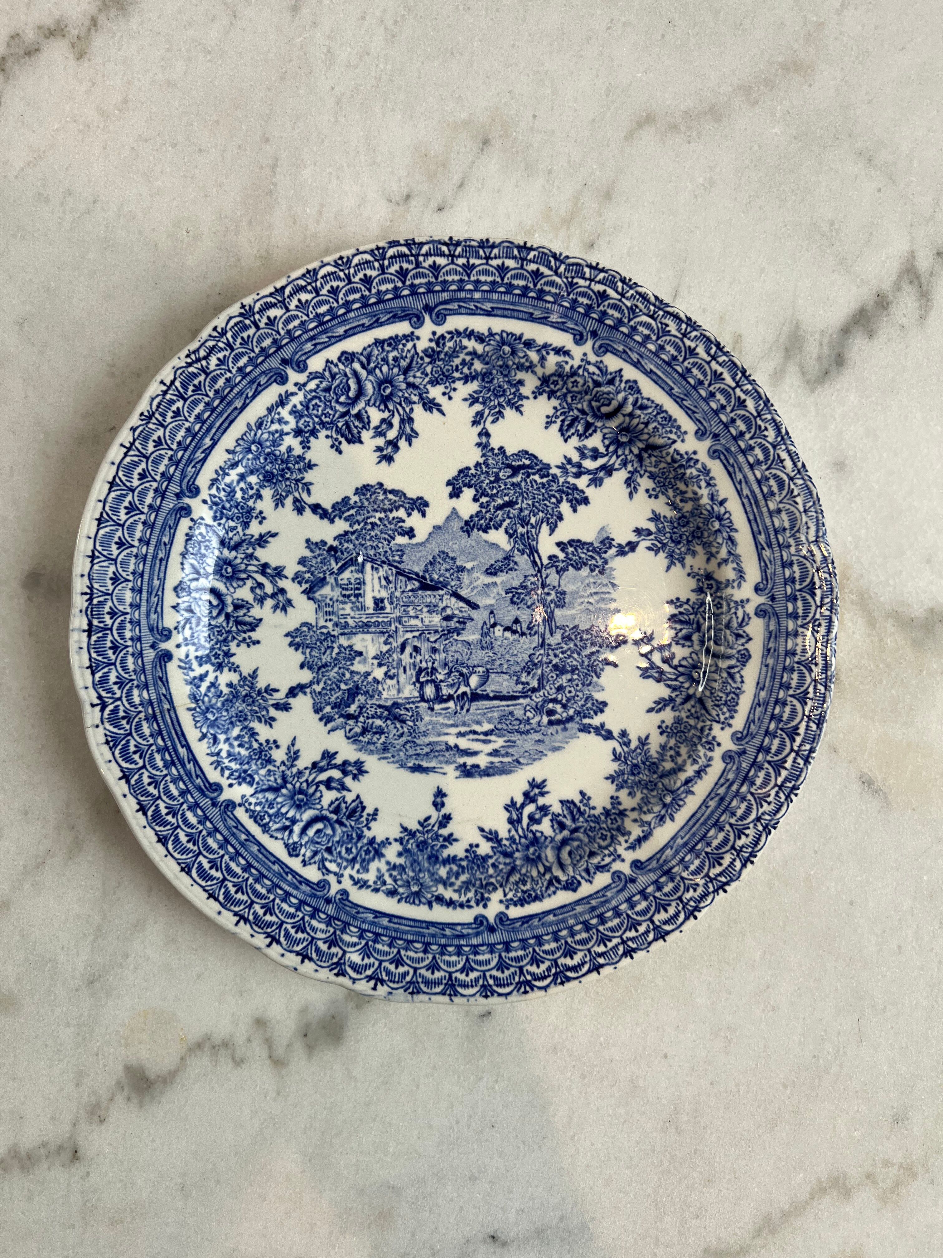 Set of four flat plates from English earthenware.