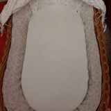 Vintage 1970s wicker cradle on wheels