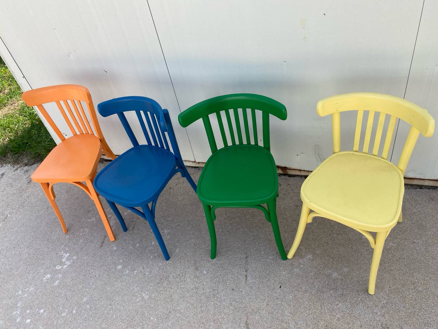 4 multi-colored bistro chairs