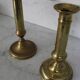 Pair of brass pusher candlesticks