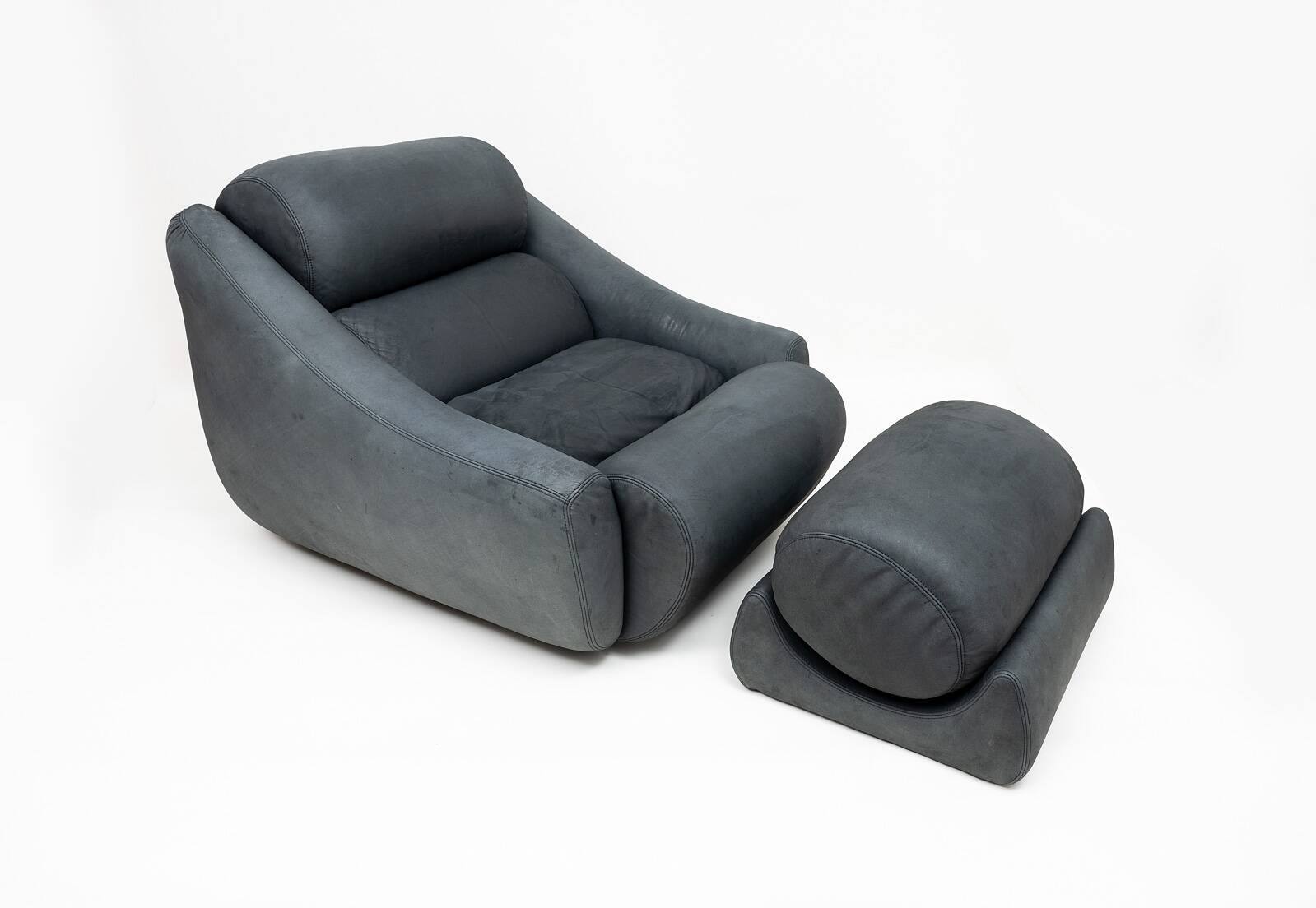 Large lounge chair and ottoman in leather, 1970