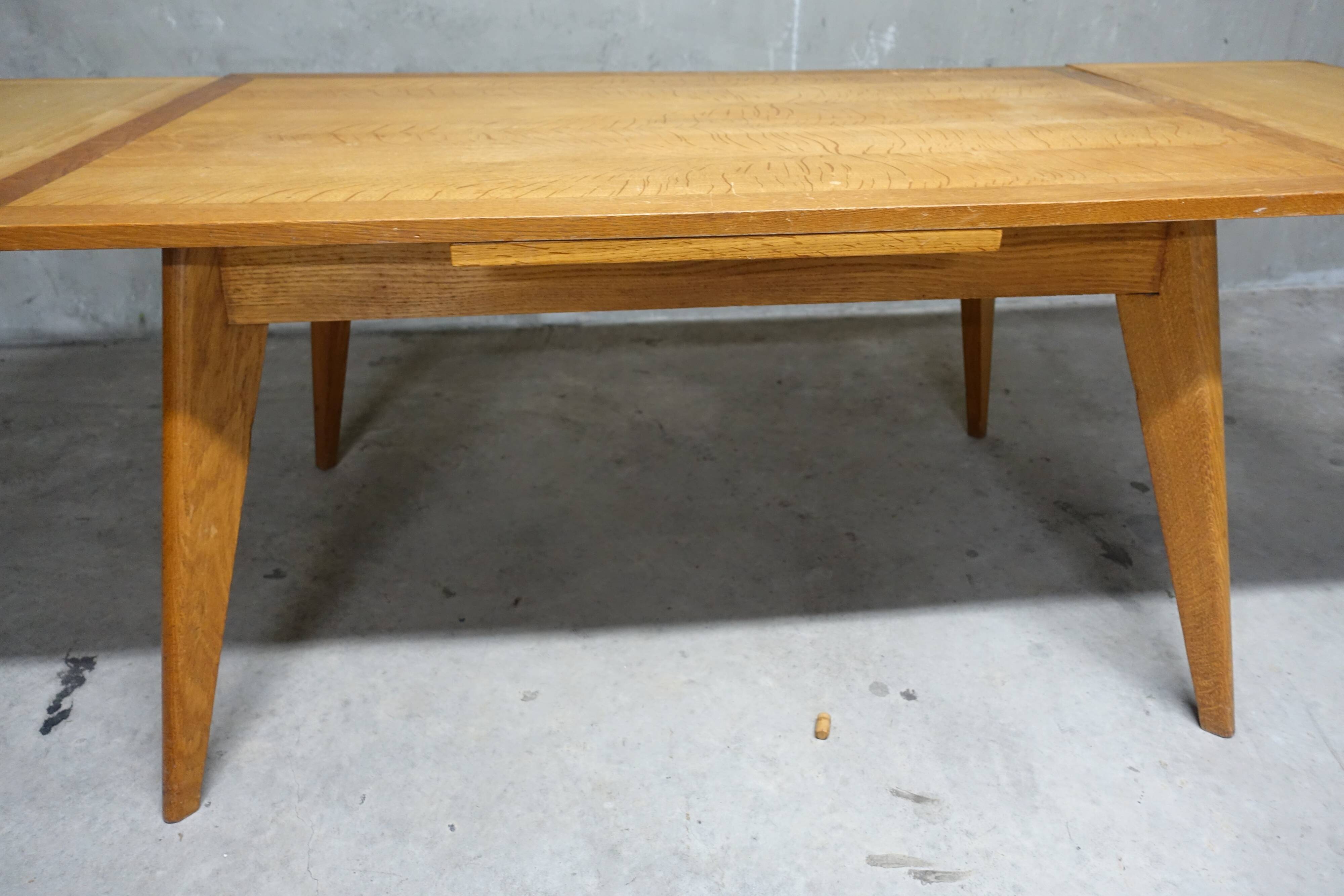 Dining table in blond oak compass feet 1950