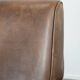 Elegant set of two sheepskin leather armchairs with beautiful round shapes