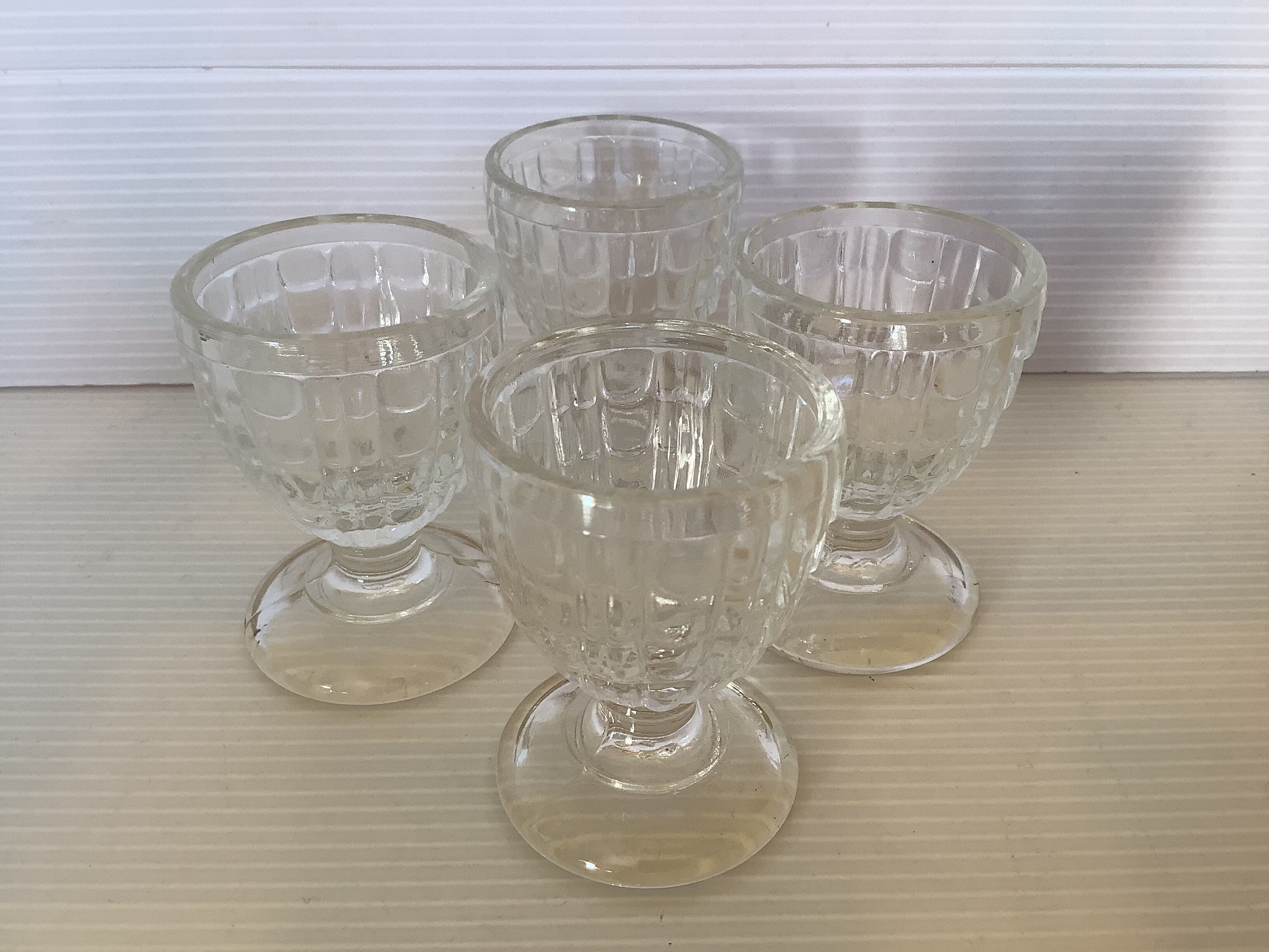 Four old molded glass shells