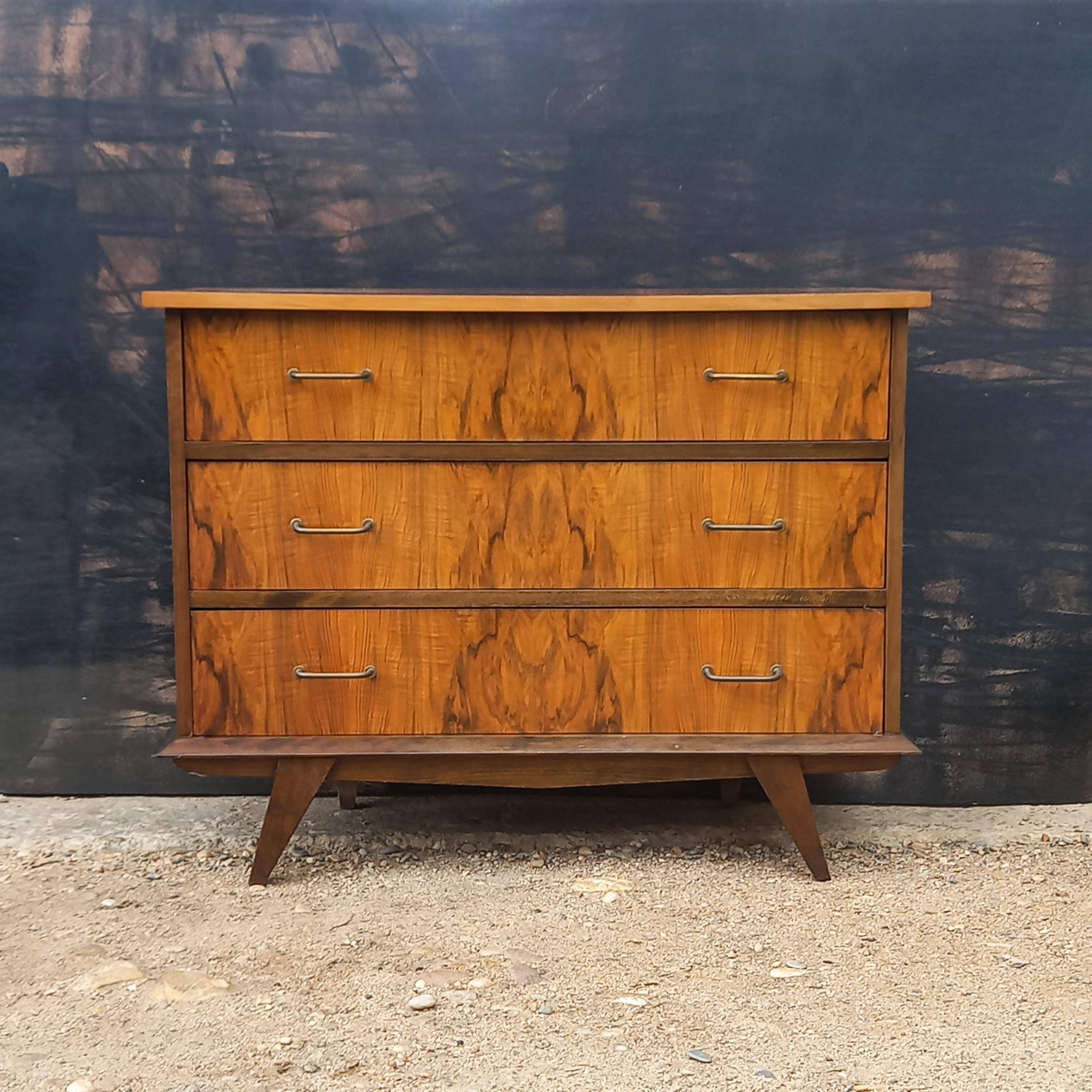 Rosewood chest of drawers with compass feet