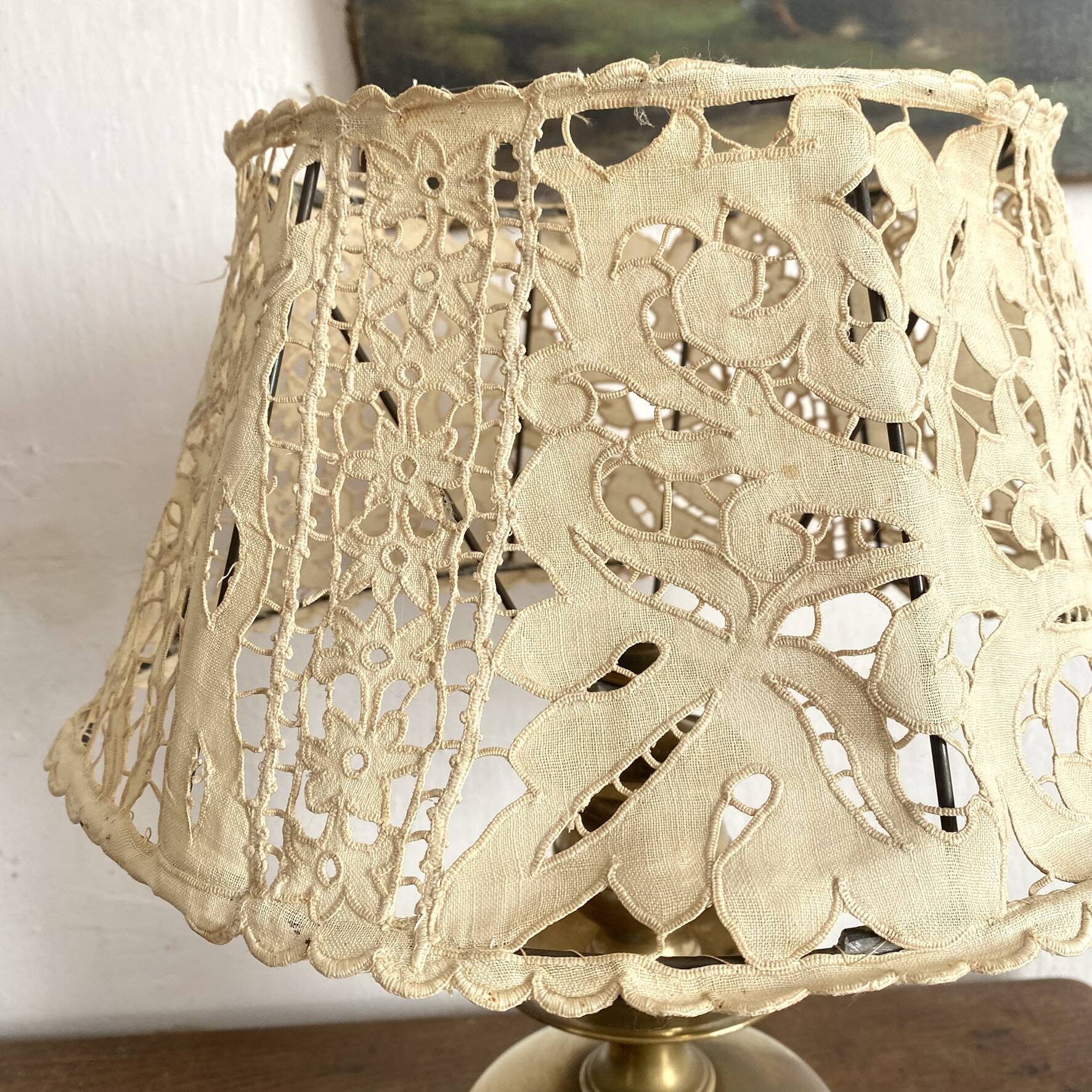 Antique brass lamp with embroidered openwork shade.