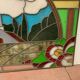 Art Deco stained glass window decorated with a 20th century church steeple