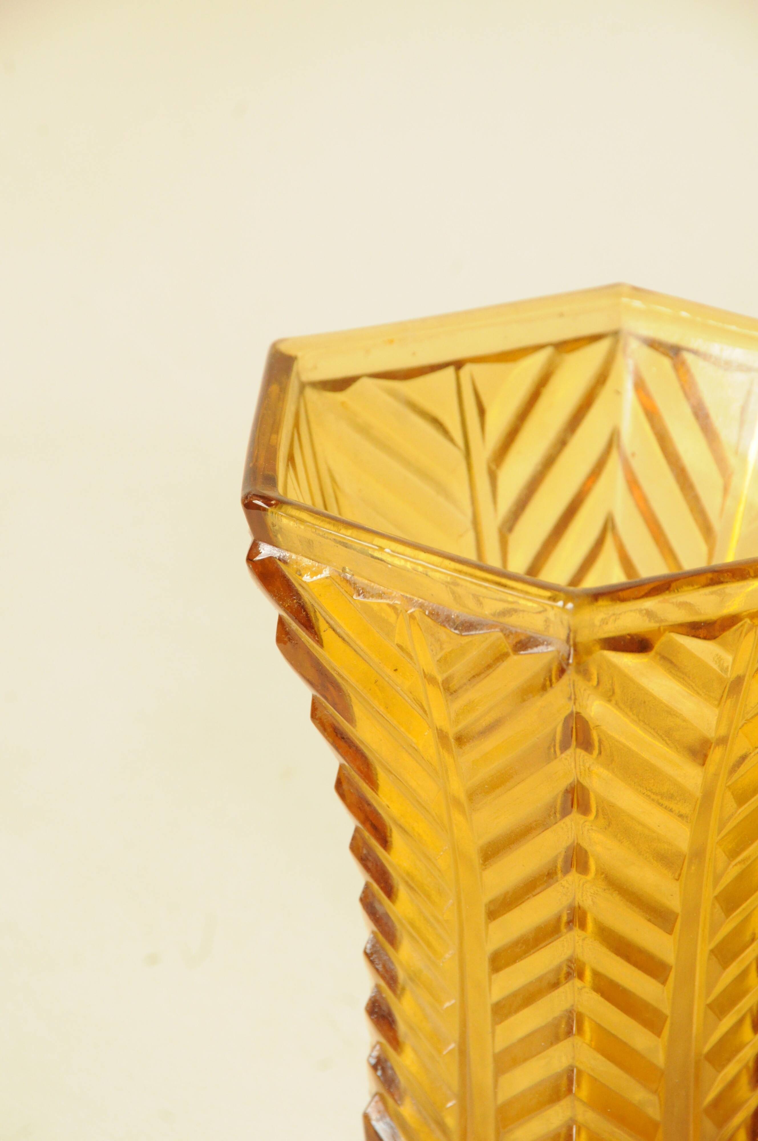 Vintage Art Deco vase in amber yellow cut glass with geometric design.