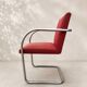 Vintage cantilever chair in chrome and burgundy fabric.