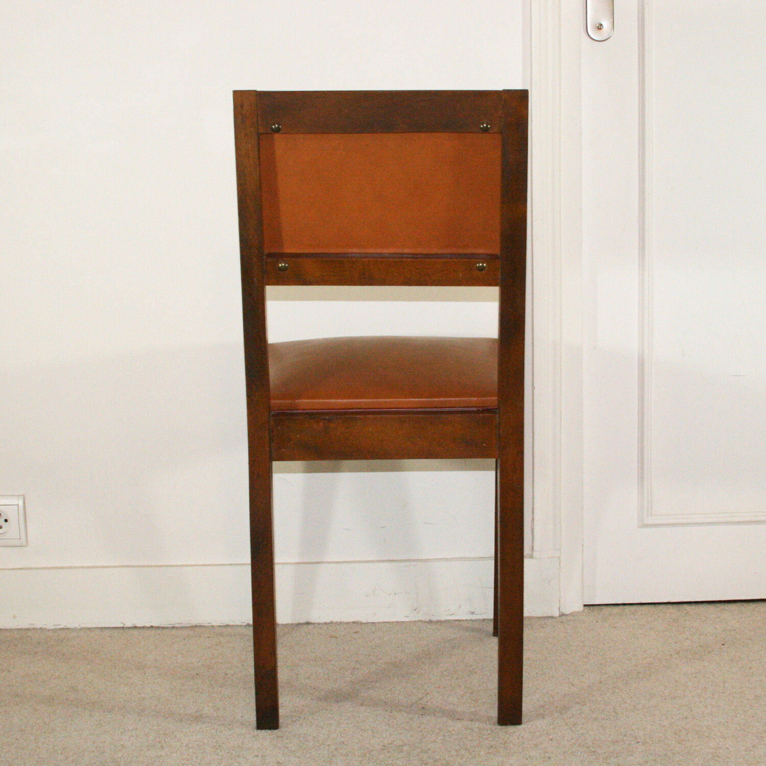 Set of four chairs in wood and leatherette