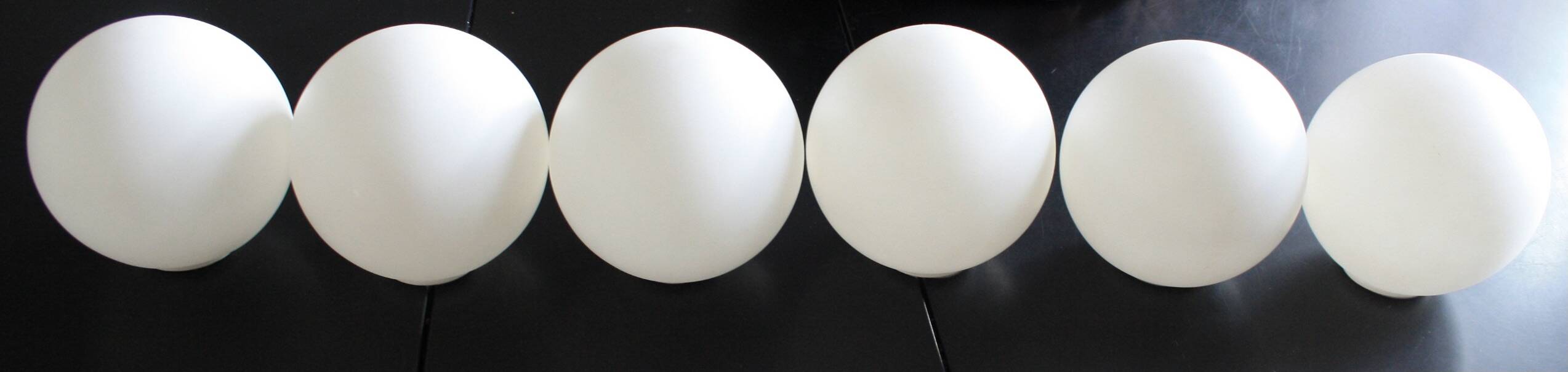 Metal chandelier and glass globes