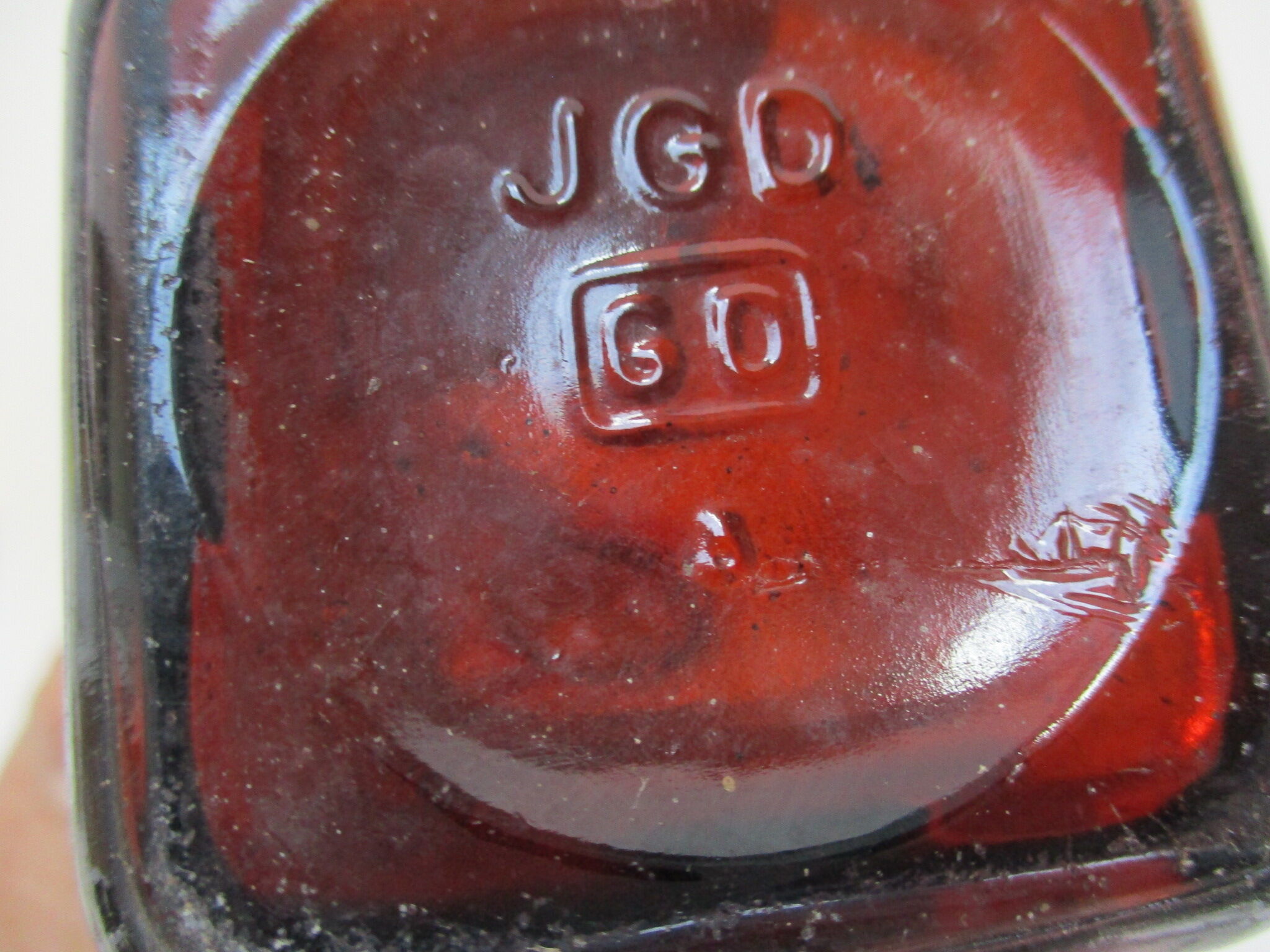 2 amber glass bottles with their old labels