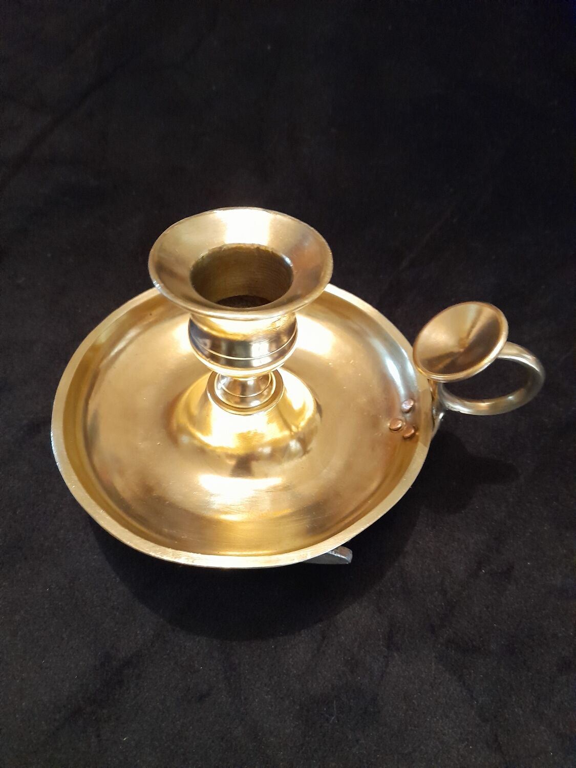 Tailed candle holder.